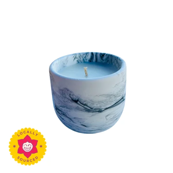 Scented candle in a blue marble effect holder