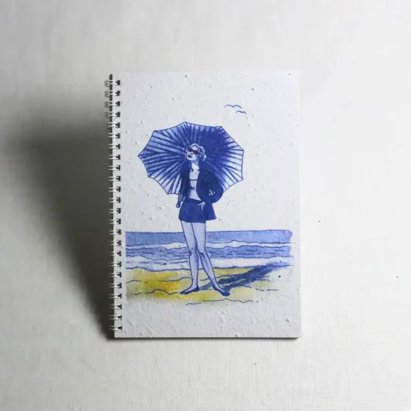 blue lady on beach holding umbrella